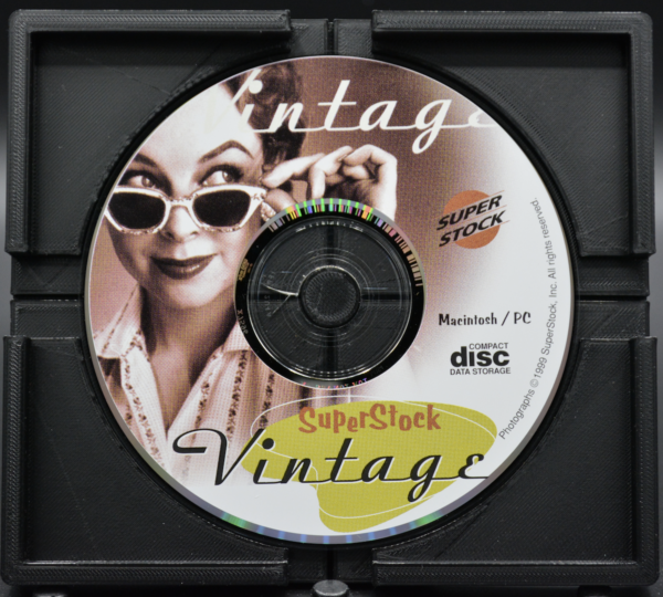 image of the CD showing a woman in sunglasses pulling them down to peer over them. CD reads "SuperStock Vintage"